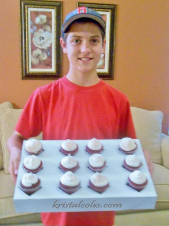 Sam getting ready to deliver a dozen red velvet cupcakes to earn his way to NYLT.